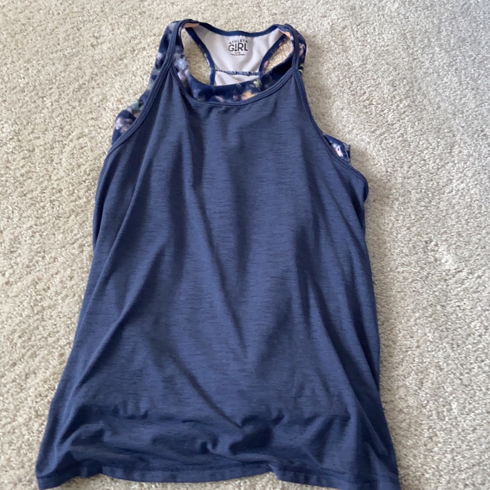 Athleta tank super cute!!! Size large in girls but fits me a size xs in women’s!